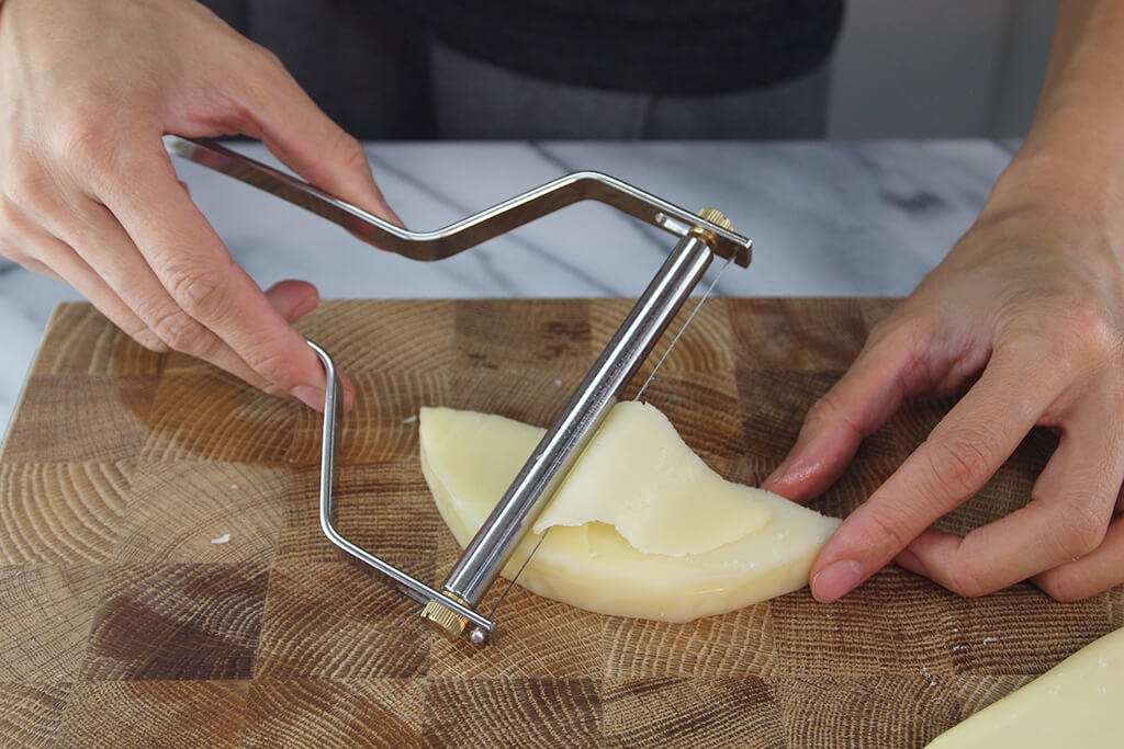 Easily handles cheese blocks up to 4" wide.